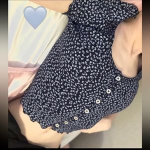 this is a dark blue frilly floral brandy top ! it’s barely been worn :3